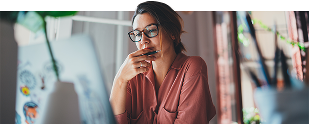 woman reading on a laptop